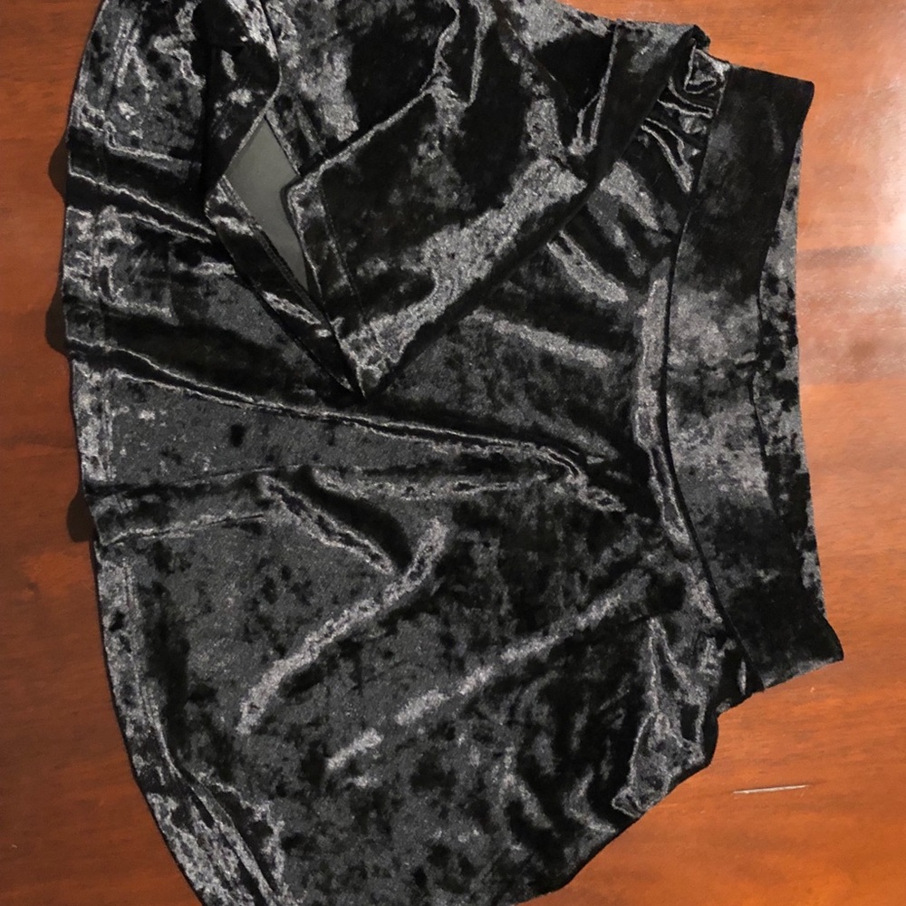 Girls black crushed velvet skirt.